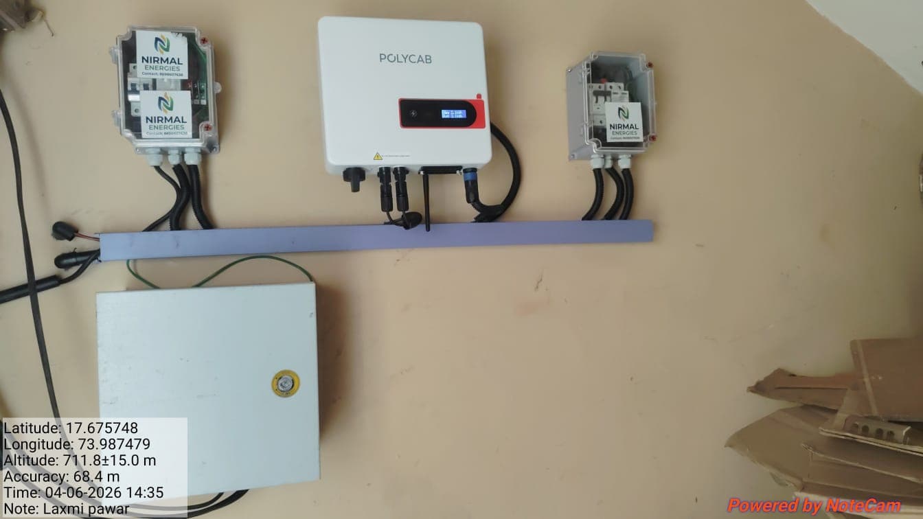 Polycab inverter between two Nirmal Energies branded distribution boxes with a geotag and timestamp overlay